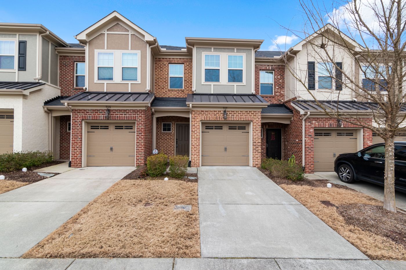 Brick homes in a Houston-area neighborhood with new roofing