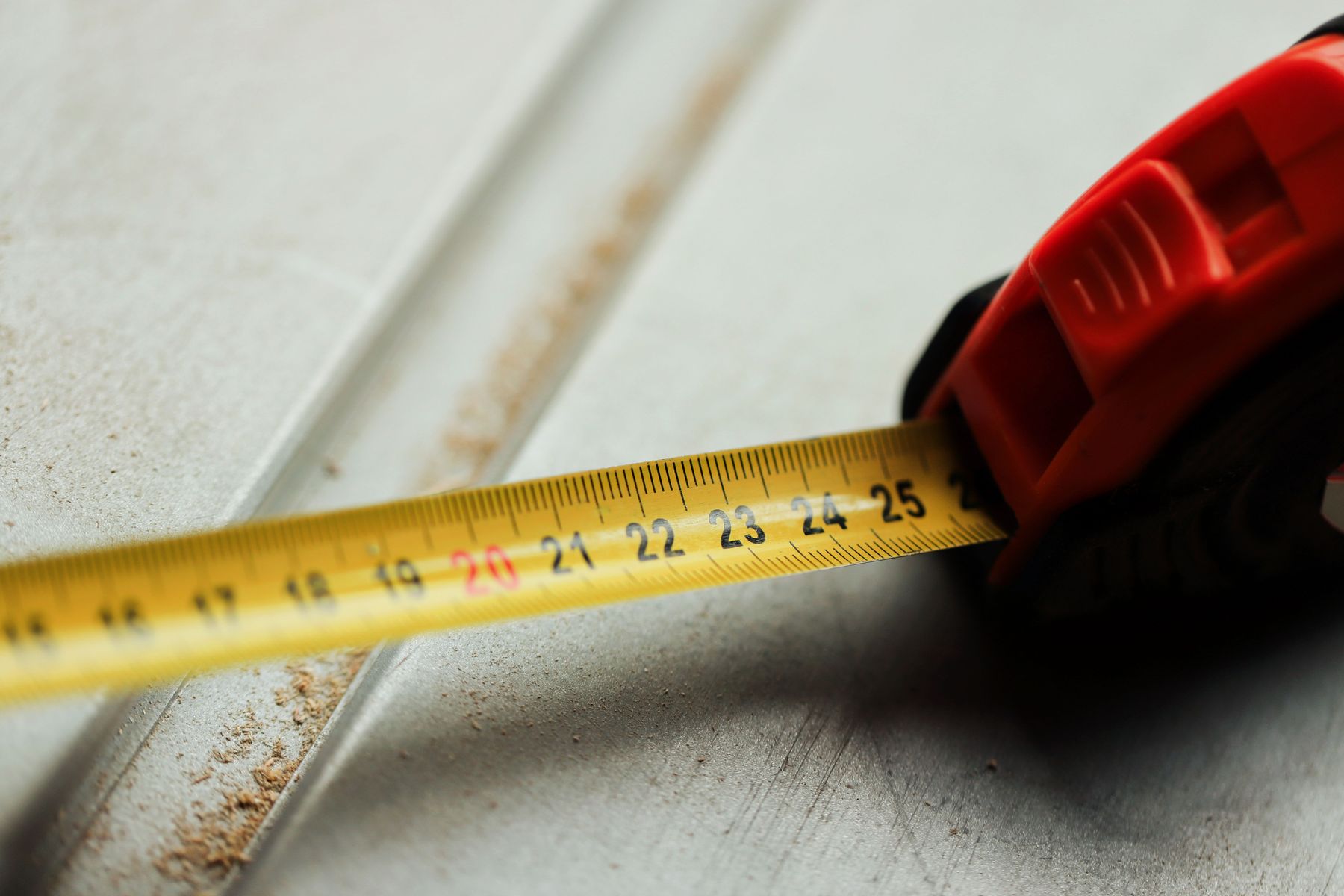Tape measure on a construction site, representing free project estimates